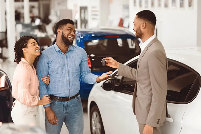 Couple buying a new car